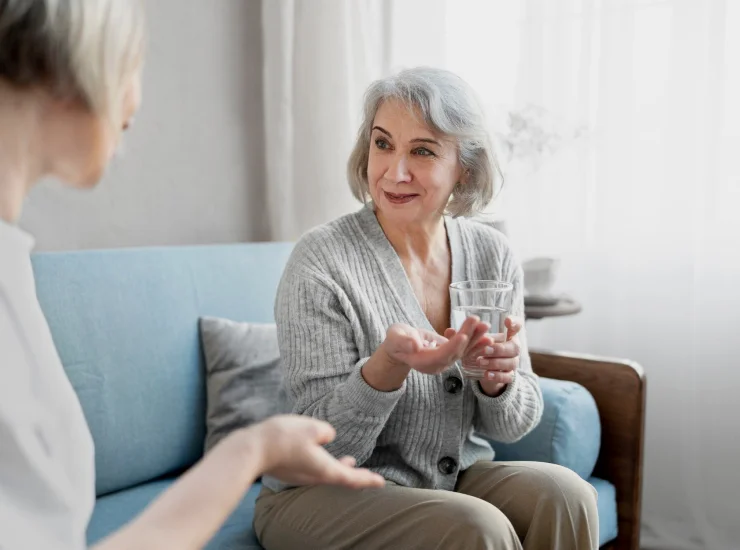Caring staff assisting senior resident at Goshen Home Care